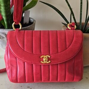 CHANEL Suede Red Shoulder Bag with Gold Hardware and Quilted Design